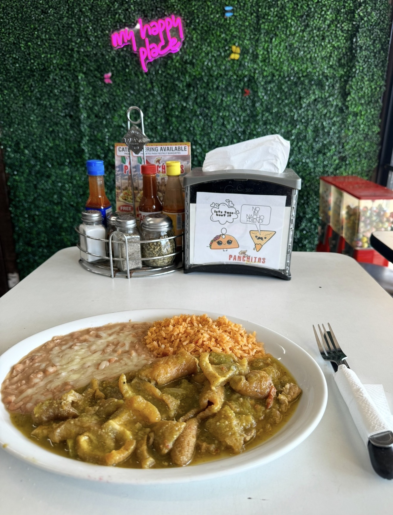 Panchitos chicharrón en salsa verde served with rice and beans